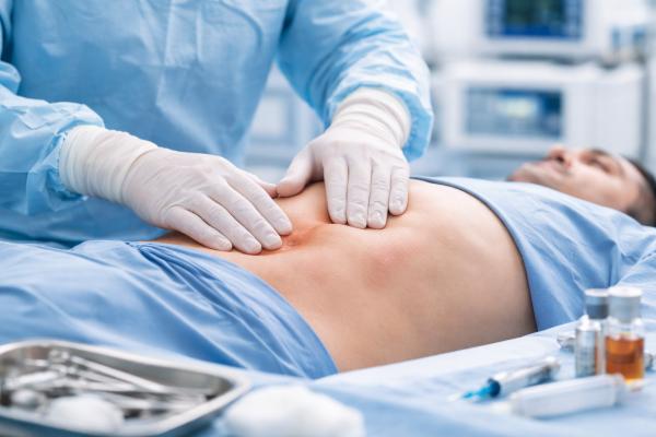 Clinical examination for recurrent hernia treatment in Coimbatore performed by Dr. K. Balu